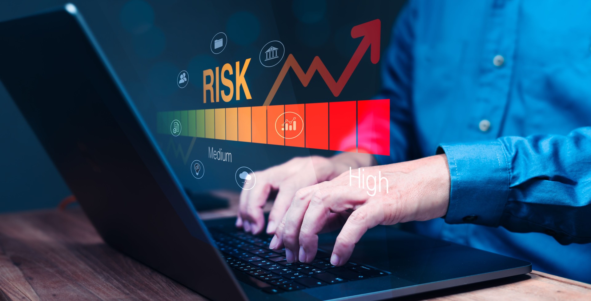 Man Analyzing Risk Graph on Laptop